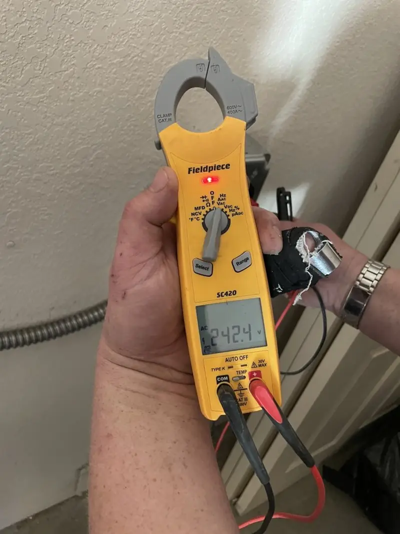 Voltage testing with clamp meter during Recessed Lighting Installation in Rineyville